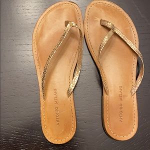 Gold leather flip flops